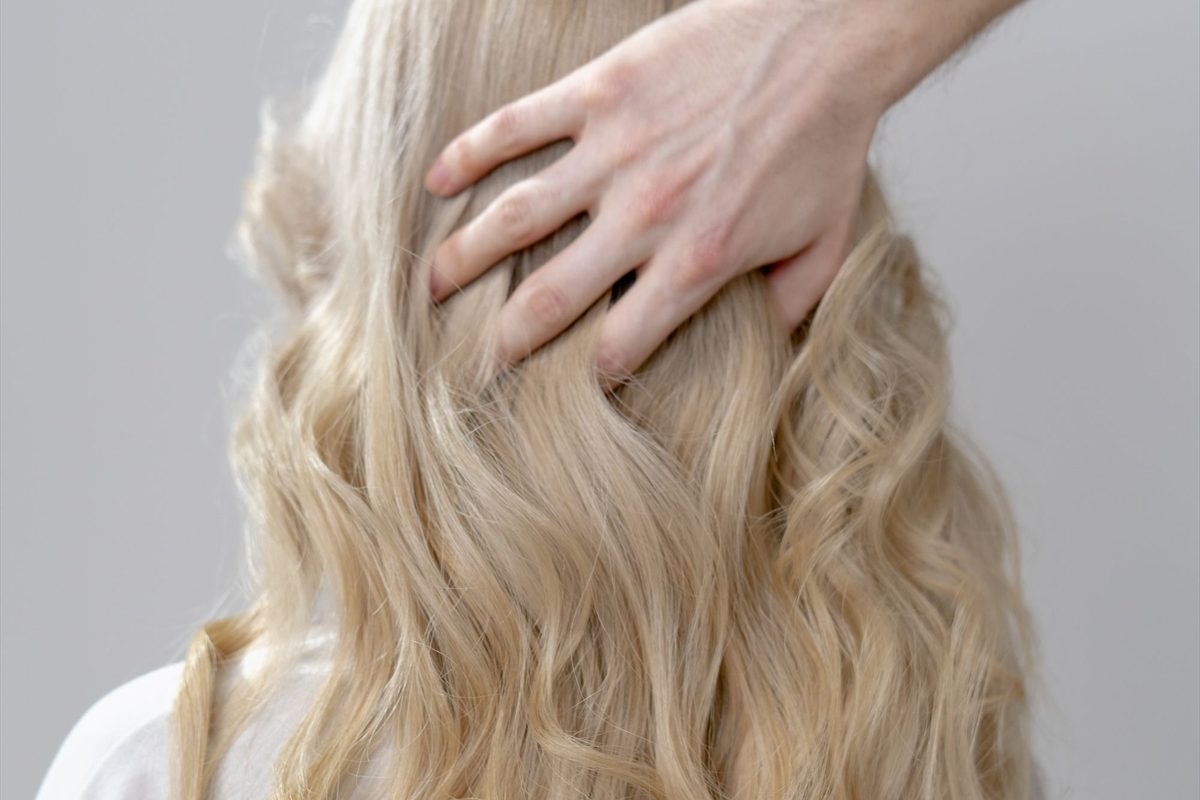 Finished soft waves after a balayage and cut
