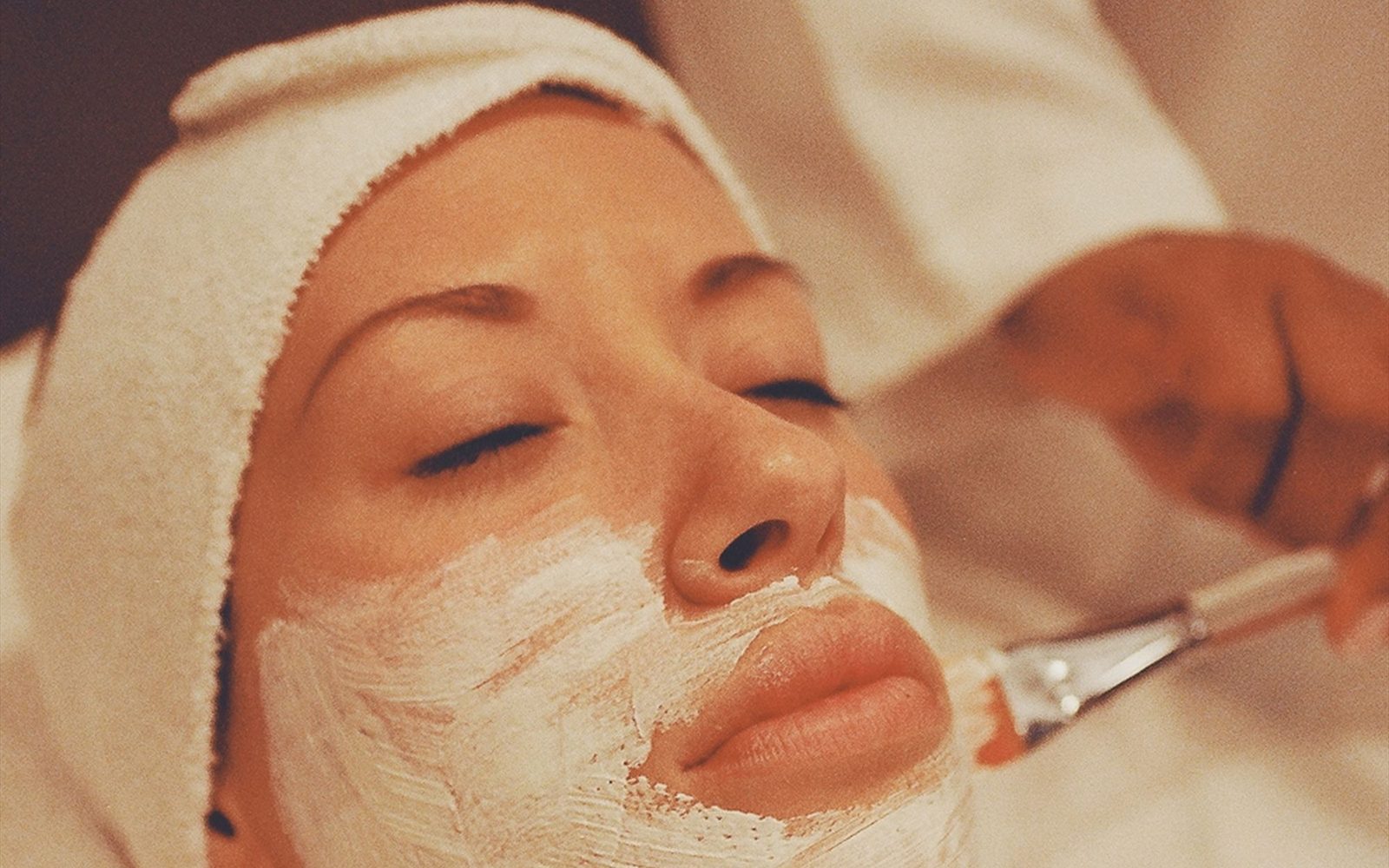 Close-up of a manicure in progress in a bright treatment room